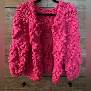 Pom pom open cardigan sweater.